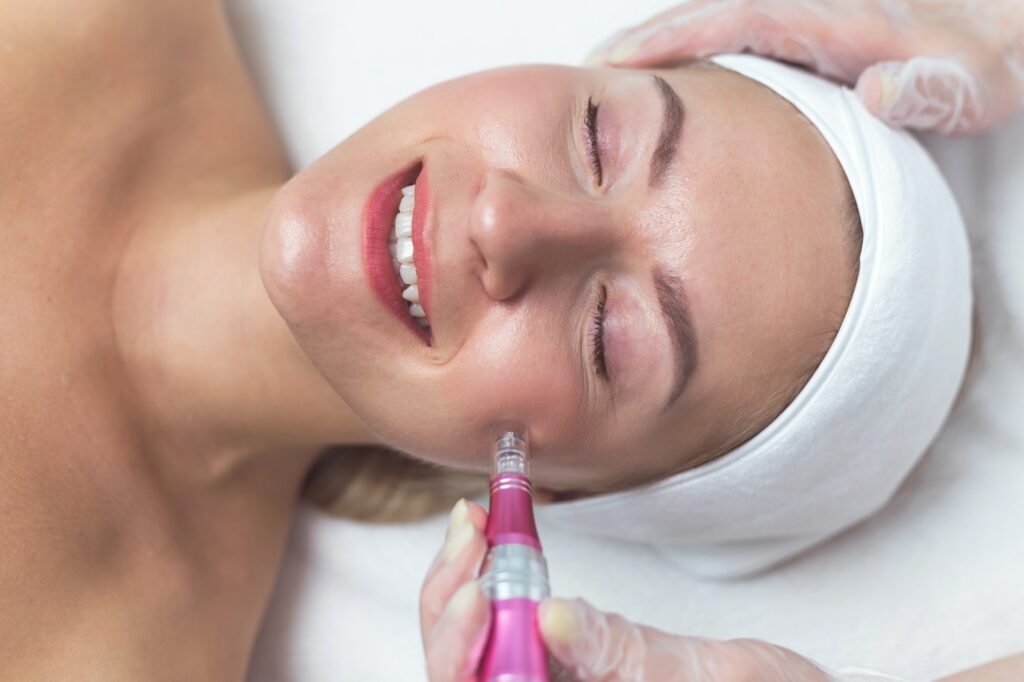 Woman having facial treatment in beauty salon, closeup. Oxy derma therapy